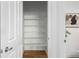 Walk-in closet with shelving and wooden floor at 8802 E 148Th Ln, Thornton, CO 80602