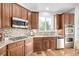 Well-equipped kitchen boasts stainless steel appliances, granite countertops, and ample cabinet space at 8802 E 148Th Ln, Thornton, CO 80602