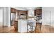 Spacious kitchen features island with seating, stainless appliances and wood cabinetry at 8802 E 148Th Ln, Thornton, CO 80602