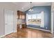 Bright kitchen area with wooden cabinetry, modern countertops, and ample natural light through a large window at 8802 E 148Th Ln, Thornton, CO 80602