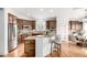 Charming kitchen with island, stainless appliances, breakfast bar, and hardwood floors at 8802 E 148Th Ln, Thornton, CO 80602