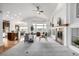 Bright, open-concept living room with a fireplace, vaulted ceilings, and comfortable seating area at 8802 E 148Th Ln, Thornton, CO 80602