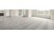 A carpeted room with bright windows and a view of a balcony at 8802 E 148Th Ln, Thornton, CO 80602