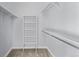 Walk-in closet with built-in shelving and lots of space for storage at 8802 E 148Th Ln, Thornton, CO 80602