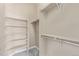 Spacious walk-in closet with built-in shelves and ample hanging space at 8802 E 148Th Ln, Thornton, CO 80602