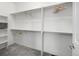 Well-organized walk-in closet with multiple shelves and rods, providing ample storage space at 8802 E 148Th Ln, Thornton, CO 80602