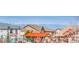 Community amenities view featuring a playground and gathering space with beautiful mountain view at 22441 E Chenango Dr, Aurora, CO 80015
