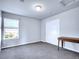 Bedroom with a window, closet, and small desk at 22441 E Chenango Dr, Aurora, CO 80015
