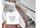 Bright entrance foyer with hardwood flooring and staircase at 22441 E Chenango Dr, Aurora, CO 80015