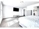 Bright primary bedroom with modern furnishings and a view into the ensuite bath at 22441 E Chenango Dr, Aurora, CO 80015