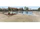 wading pool with fun water features and nearby shaded seating areas for parents at 22441 E Chenango Dr, Aurora, CO 80015