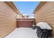 Small backyard with snow-covered patio and grill at 8551 Gold Peak Dr # B, Highlands Ranch, CO 80130