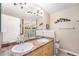 Clean bathroom with double sinks, shower, and bathtub at 8551 Gold Peak Dr # B, Highlands Ranch, CO 80130