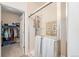 Updated bathroom with walk-in shower and linen closet at 8551 Gold Peak Dr # B, Highlands Ranch, CO 80130