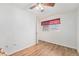 Cozy bedroom featuring wood flooring and window coverings at 8551 Gold Peak Dr # B, Highlands Ranch, CO 80130