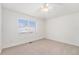 Simple bedroom with carpeted floor and window blinds at 8551 Gold Peak Dr # B, Highlands Ranch, CO 80130