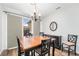Dining area with hardwood floors, sliding door to patio, and chandelier at 8551 Gold Peak Dr # B, Highlands Ranch, CO 80130