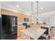Modern kitchen with granite countertops and stainless steel appliances at 8551 Gold Peak Dr # B, Highlands Ranch, CO 80130