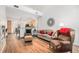 Open living area with hardwood floors, fireplace, and access to kitchen at 8551 Gold Peak Dr # B, Highlands Ranch, CO 80130