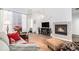 Living room featuring hardwood floors, fireplace, and open floor plan at 8551 Gold Peak Dr # B, Highlands Ranch, CO 80130