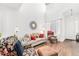 Bright living room with hardwood floors, cozy seating, and high ceilings at 8551 Gold Peak Dr # B, Highlands Ranch, CO 80130