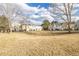 Scenic view of a large grassy area bordered by townhomes in a peaceful community at 3281 S Estes St, Lakewood, CO 80227