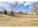 Vast, grassy common area surrounded by homes, offering an open and communal outdoor space at 3281 S Estes St, Lakewood, CO 80227