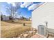 Expansive backyard with landscaping, grassy area, and distant views of neighboring properties at 3281 S Estes St, Lakewood, CO 80227