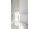 Bathroom features marble tile surrounding a shower and tub combo at 3281 S Estes St, Lakewood, CO 80227