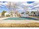 Pool with cover shows a neighborhood recreation area for residents to enjoy swimming during warmer months at 3281 S Estes St, Lakewood, CO 80227