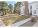 Inviting two-story townhome featuring a brick chimney and well-maintained front lawn at 3281 S Estes St, Lakewood, CO 80227