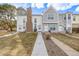 Inviting townhouses featuring well-kept lawns and neutral exterior colors at 3281 S Estes St, Lakewood, CO 80227