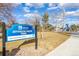 Sign identifies Jefferson Green Park with amenities including community garden and playground at 3281 S Estes St, Lakewood, CO 80227