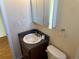 Functional bathroom featuring a vanity with sink and a mirrored medicine cabinet at 7870 Magnolia St, Commerce City, CO 80022