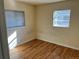 Cozy bedroom with natural light, hardwood floors, and neutral-colored walls at 7870 Magnolia St, Commerce City, CO 80022