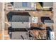 An aerial view of the property showcasing the house, backyard, storage shed, and surrounding neighborhood at 4166 N Yates St, Denver, CO 80212