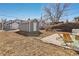 Spacious backyard showcasing a storage shed and a cozy patio with outdoor seating at 4166 N Yates St, Denver, CO 80212