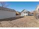 Backyard view with a shed, garage, and patio with seating at 4166 N Yates St, Denver, CO 80212