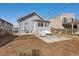 Backyard features a patio area with seating and a well-maintained lawn at 4166 N Yates St, Denver, CO 80212