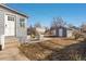 Backyard with patio, shed, and exterior door at 4166 N Yates St, Denver, CO 80212