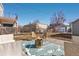 Backyard patio with outdoor seating and a fire pit, perfect for relaxation and entertainment at 4166 N Yates St, Denver, CO 80212