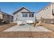 Landscaped backyard features a paved patio with stylish outdoor seating and a fire pit for entertaining at 4166 N Yates St, Denver, CO 80212