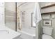 Bright bathroom featuring a soaking tub, modern fixtures, and a shower-tub combo at 4166 N Yates St, Denver, CO 80212