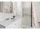 Bright bathroom featuring white vanity, modern fixtures, and a shower-tub combo at 4166 N Yates St, Denver, CO 80212
