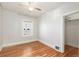 Empty bedroom with natural light, hardwood floors, and a closet at 4166 N Yates St, Denver, CO 80212