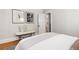 A bedroom showcases light and airy decor, wood floors, and neutral accents at 4166 N Yates St, Denver, CO 80212