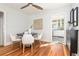 Dining area with hardwood floors, a modern table setting, and an open view to the kitchen at 4166 N Yates St, Denver, CO 80212