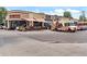 Exterior view of Fat Sully's restaurant, featuring outdoor seating and a food truck at 4166 N Yates St, Denver, CO 80212