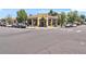 Exterior of a commercial building with a yellow facade, modern windows and ample parking at 4166 N Yates St, Denver, CO 80212
