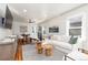 Spacious living room with hardwood floors and modern decor, open to dining area at 4166 N Yates St, Denver, CO 80212
